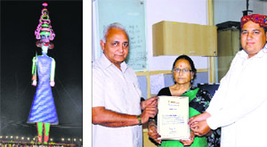 The effigy of demon king Ravan; and (right) president of the Barara Ram Leela Club Tejinder Chauhan receiving the certificate of Limca World Record from Vijaya Ghose.