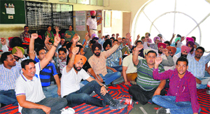 Members of the Inspector 2010 Batch Union, Punjab (Food, Civil Supplies and Consumer Affairs), raise slogans against the authorities at the DFSC office in Ludhiana. 