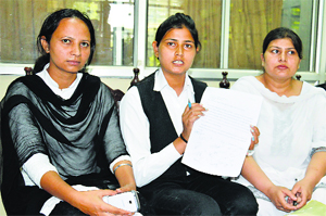 Meena Rani and her colleagues address mediapersons in Ludhiana. 