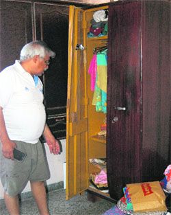 A man shows a ransacked almirah at the victims flat at the MDC, Panchkula, on Wednesday. 