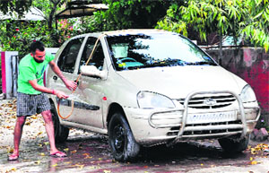 Washing vehicles with potable water during the morning hours has become a common practice in the city.