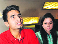 Karanveer Singh, a player of Kings XI Punjab, along with his wife Tanvi, addresses a press conefrence at a hotel in Sector 34, Chandigarh, on Wednesday.