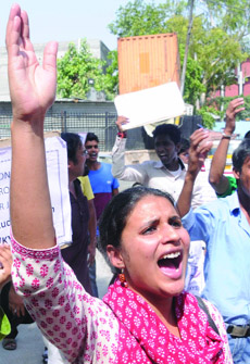 SOL students/aspirants protesting in front of the UGC headquarters, demanding action against Delhi University which has postponed undergraduate admissions, in New Delhi on Wednesday.