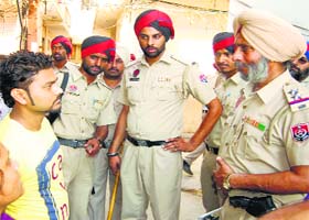 Fighting drug menace: The city police conduct a raid at the Qazi Mandi to check drugs in Jalandhar on Wednesday