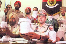 ADCP Satvir Atwal shows the seized heroin to the media