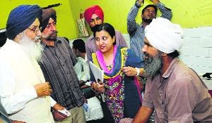 CM Parkash Singh Badal meets a patient at a de-addiction centre in Bathinda.