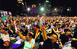 People take part in a candlelight vigil in Hong Kong on Wednesday to mark the 25th anniversary of the military crackdown on the pro-democracy movement at Beijings Tiananmen Square