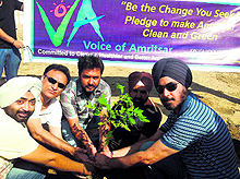 Volunteers of the NGO Voice of Amritsar plant a sapling on the occasion of World Environment Day