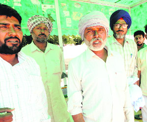 Om Prakash (second from left), father of Gurpreet Singh, at the GMSH, Sector 16, Chandigarh, on Thursday.