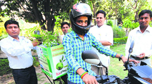Nazim Ahmad (extreme left), founder of the Hello Green Project, launches the free sapling delivery service at Gandhi Smarak, Sector 16, Chandigarh, on Thursday.