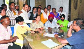 BJP councillors register their protest against the alleged mismanagement in the distribution of ration cards in Dehradun on Thursday.
