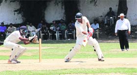Players in action during a cricket match in Dehradun on Thursday.