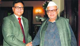 Uttarakhand Governor Dr Aziz Qureshi (right) greets newly appointed officiating Chief Justice of Nainital High Court Justice VK Bisht in Nainital on Thursday.