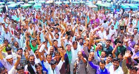 Auto-Vikram union members stage a protest in Haridwar on Thursday.
