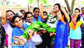 Jubilant Class 12 students of a private school celebrate their success in Rohtak