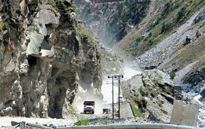 Vehicles move slowly on a dusty NH-22 in Kinnaur district.