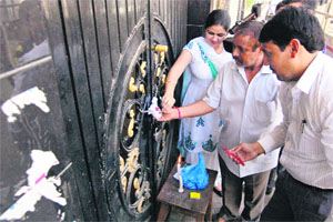 Drug Licensing Authority staff seals the godown where suspected banned drugs were stored at Gopal Nagar in Jalandhar on Thursday.