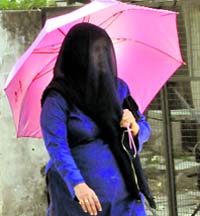 A girl all covered up to beat the heat near the PU, Chandigarh, on Friday.