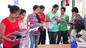Students buy prospectus for the academic session 2014-15 at Guru Gobind Singh College for Women, Sector 26, in Chandigarh on Friday.