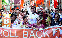 Activists of the ABVP shout slogans during a protest outside the UGC office against the Four-Year Undergraduate Programme at Delhi University in New Delhi on Friday