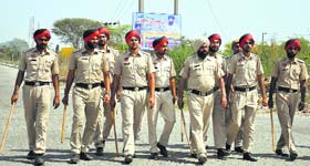 Policemen carry out patrolling at the Bidipur railway crossing in Jalandhar on Friday