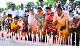 Congress workers hold a candlelight march in Jalandhar on Friday