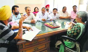 District president of the BJP Parveen Bansal interacts with the officials of the DETC in Ludhiana on Friday