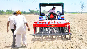 A farmer uses a machine for direct sowing of paddy in his fields in Cheema village of Sangrur district.