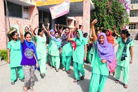 Students of the GNM Training School and Civil Hostpital shout slogans outside the Civil Surgeons office in Bathinda on Saturday
