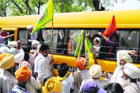 Police detain members of the BKU Ugrahan during a protest in Bathinda on Saturday