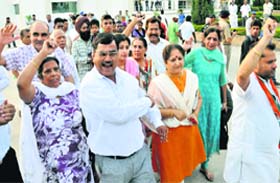 Supporters of Kumari Selja protest against Chief Minister Bhupinder Singh Hooda after walking out of a workers’ meeting in Sector 5, Panchkula, on Saturday
