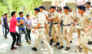 The police cane-charge students protesting the fee hike in HPU in Shimla on Saturday. 