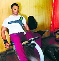 Chetan Sharma tries on a workout on a new machine