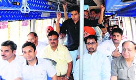 Local Bodies Minister Anil Joshi (second from left) with Mayor Bakshi Ram Arora and other officials takes a ride in a new bus added to the fleet.