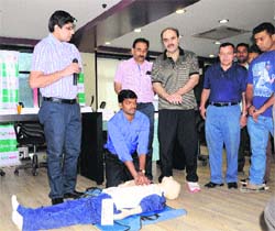 Dr Naresh Grover and Dr Arun Chopra at a workshop on cardio pulmonary resuscitation at Talwalkars Gym in Amritsar on Sunday.