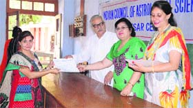 ICAS national vice-president MN Kedar and Amritsar chapter chairperson Kiranjit Kaur present certificates to students at DAV College in Amritsar on Sunday.