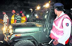 Headlights of a private vehicle being used to light up the area for the rescue operation
