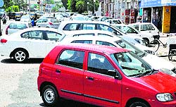 Vehicles parked haphazardly at a parking lot of the Phase I market in Mohali