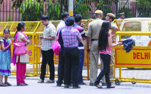 Visitors at the National Museum stopped on Janpath Road as no traffic was allowed during the meeting of Chinese Foreign Minister Wang Yi at Jawahar Bhawan in New Delhi on Sunday.