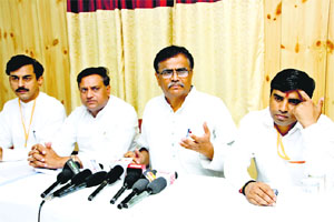 BJP Kisan Morcha president Om Prakash Dhankar addresses mediapersons on the conclusion of a two-days national executive meeting in Bahadurgarh town of Jhajjar district on Sunday. 
