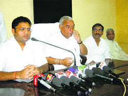 HPCC chief Ashok Tanwar addresses mediapersons in Panipat on Sunday as CM Bhupinder Singh Hooda looks on. 
