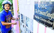 A youth shows a non-functional water cooler in Jammu
