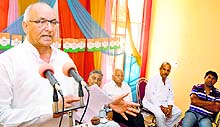 Congress leader Balwan Singh addresses party workers on the outskirts of Jammu on Sunday