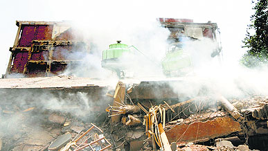 Smoke billows out of the debris of the collapsed building of the NIELIT at Sector 17, Chandigarh, on Monday.