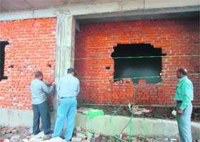 MDDA officials seal an illegally constructed building in Dehradun on Monday