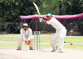 Top shot: Players in action in a cricket match in Dehradun on Monday