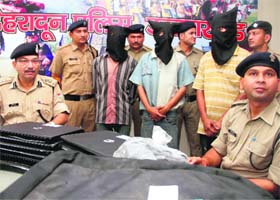 The accused thieves in police custody in Dehradun on Monday
