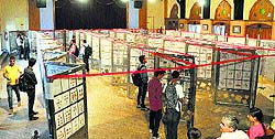 Visitors during a philately exhibition at the Gaiety Theatre in Shimla on Monday