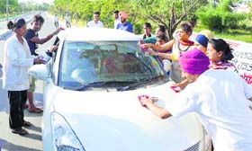 The protesting students clean a car at GADVASU
