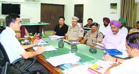 DC Rajat Aggarwal addresses a meeting of the District Road Safety Committee in Ludhiana